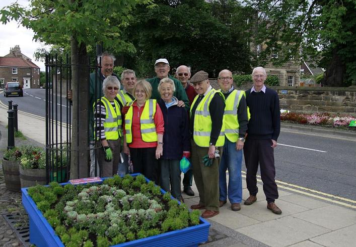 Some passers by rounded up to improve the photograph