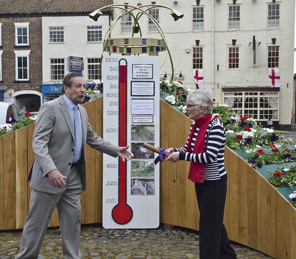 George Carter hands over the scroll to Linda