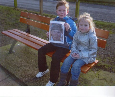 George and Hannah showing a picture of Charlie