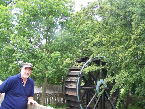 Tom Fidler with the restored wheel from Fidler's Mill