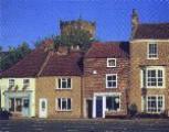 A fine corner of the High Street with the church in the background